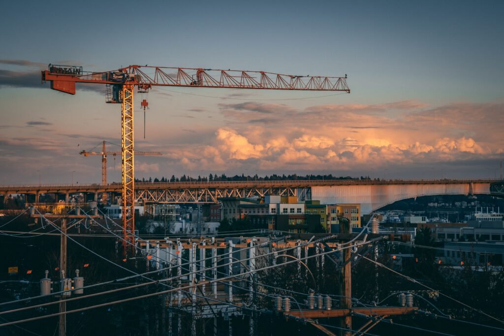 A construction site with crane during sunset